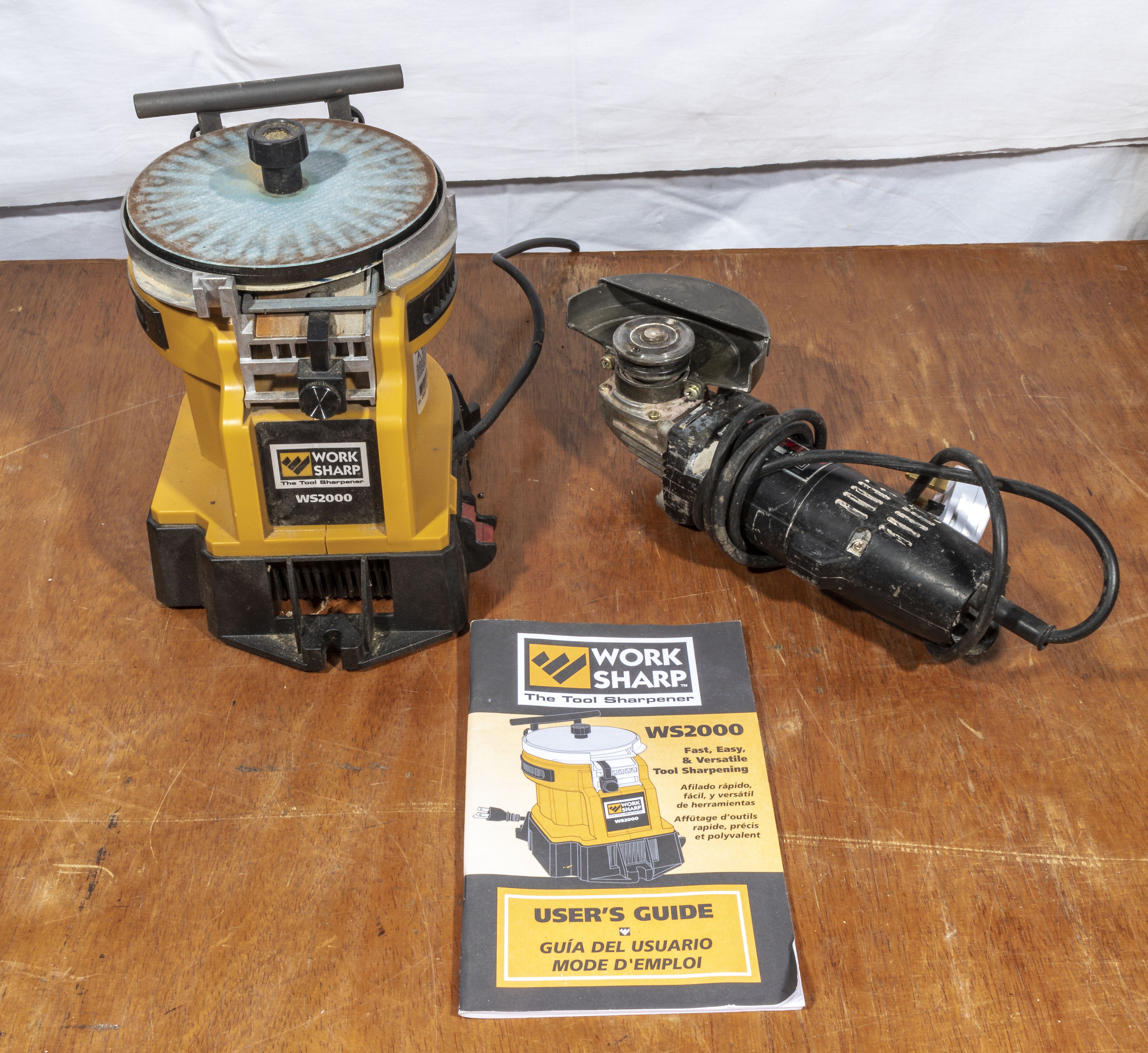 A Worksharp ws2000 tool sharpener together with an angle grinder