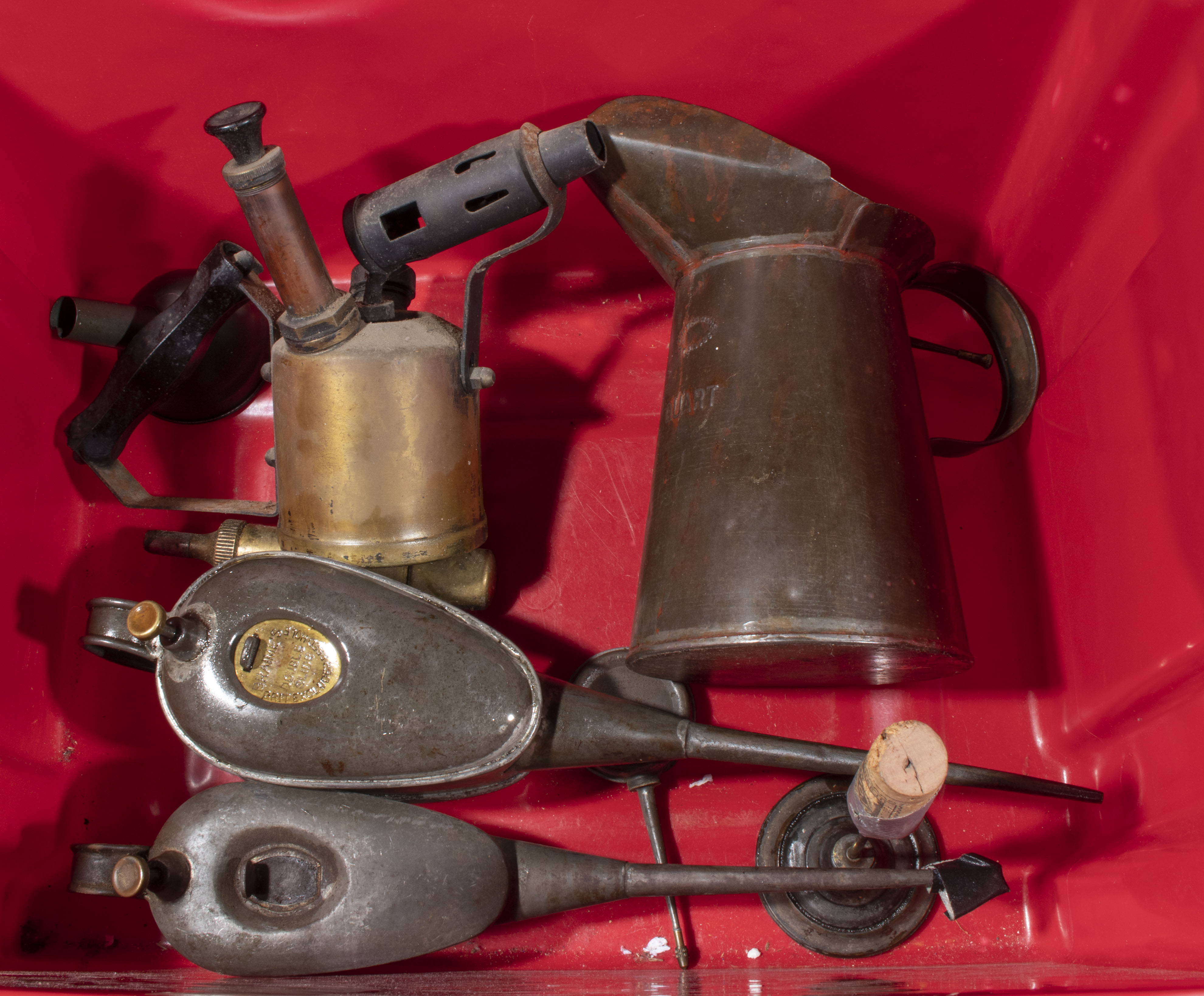 Two vintage oil cans, blow torch and an oil jug