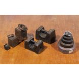 A collection of assorted cast scale weights