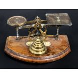 A small set of letter weigh scales and brass weights