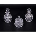 Two crystal scent bottles and a lidded bowl