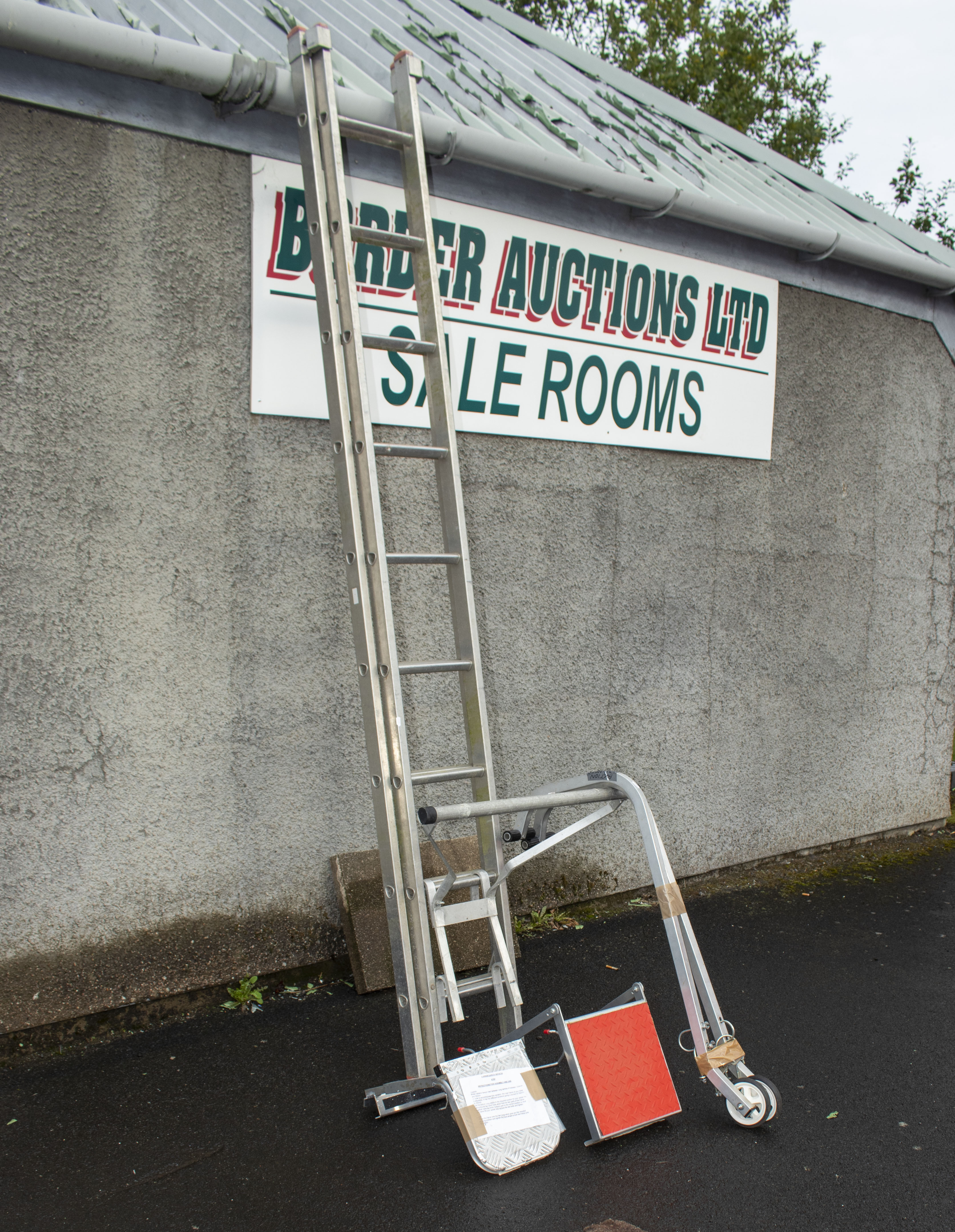 An extension ladder, stand off, 2 roof wheels and two platforms