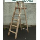 A pair of wooden step ladders