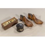 A pair of small vintage wooden shoe lasts together with a set of dominoes and a small box.