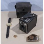 A Kodak Brownie box camera together with a watch, ring and coins