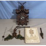 A Black Forest cuckoo clock and a book on Black Forest clocks signed by Karl Kochmann
