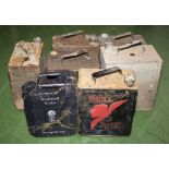 Seven assorted vintage petrol cans