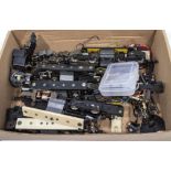 A box containing Hornby Dublo motors and other parts