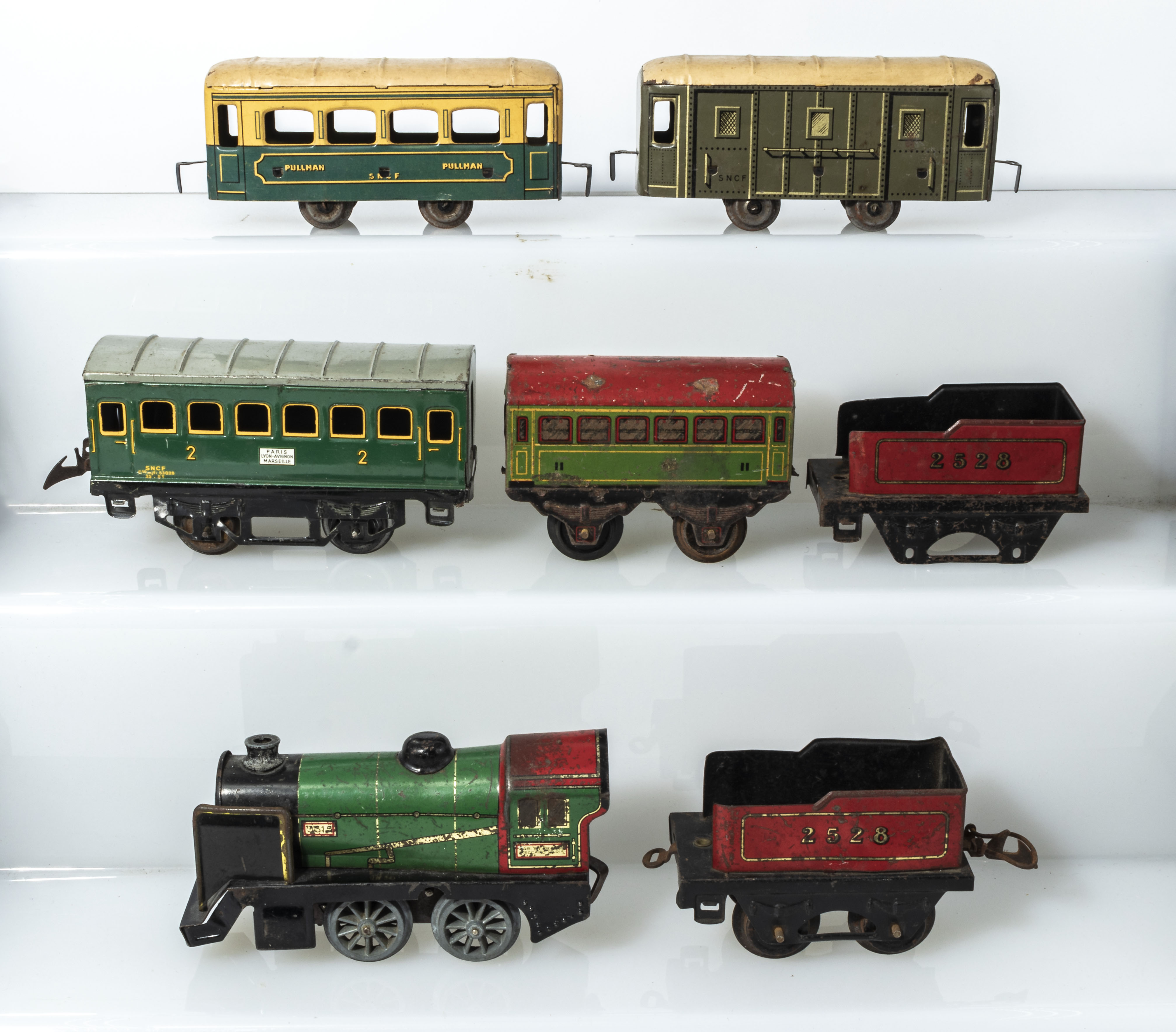French Hornby clockwork engine 3615 together with two tenders, passenger car and three other small