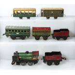 French Hornby clockwork engine 3615 together with two tenders, passenger car and three other small
