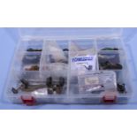 A box of Hornby spare wheels, couplings and assorted pieces