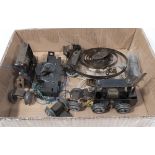A box containing locomotive spares and one clockwork motor spare