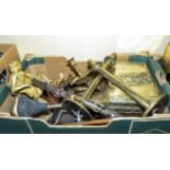 A box containing copper and brass items