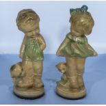 A pair of vintage chalk figures of a girl and boy