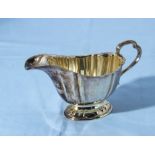 A silver cream jug marks for Sheffield 1930, 200gms