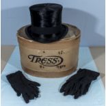 A vintage top hat and two pairs of gloves
