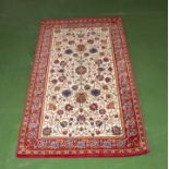 A red ground wool rug 80cm x 150cm
