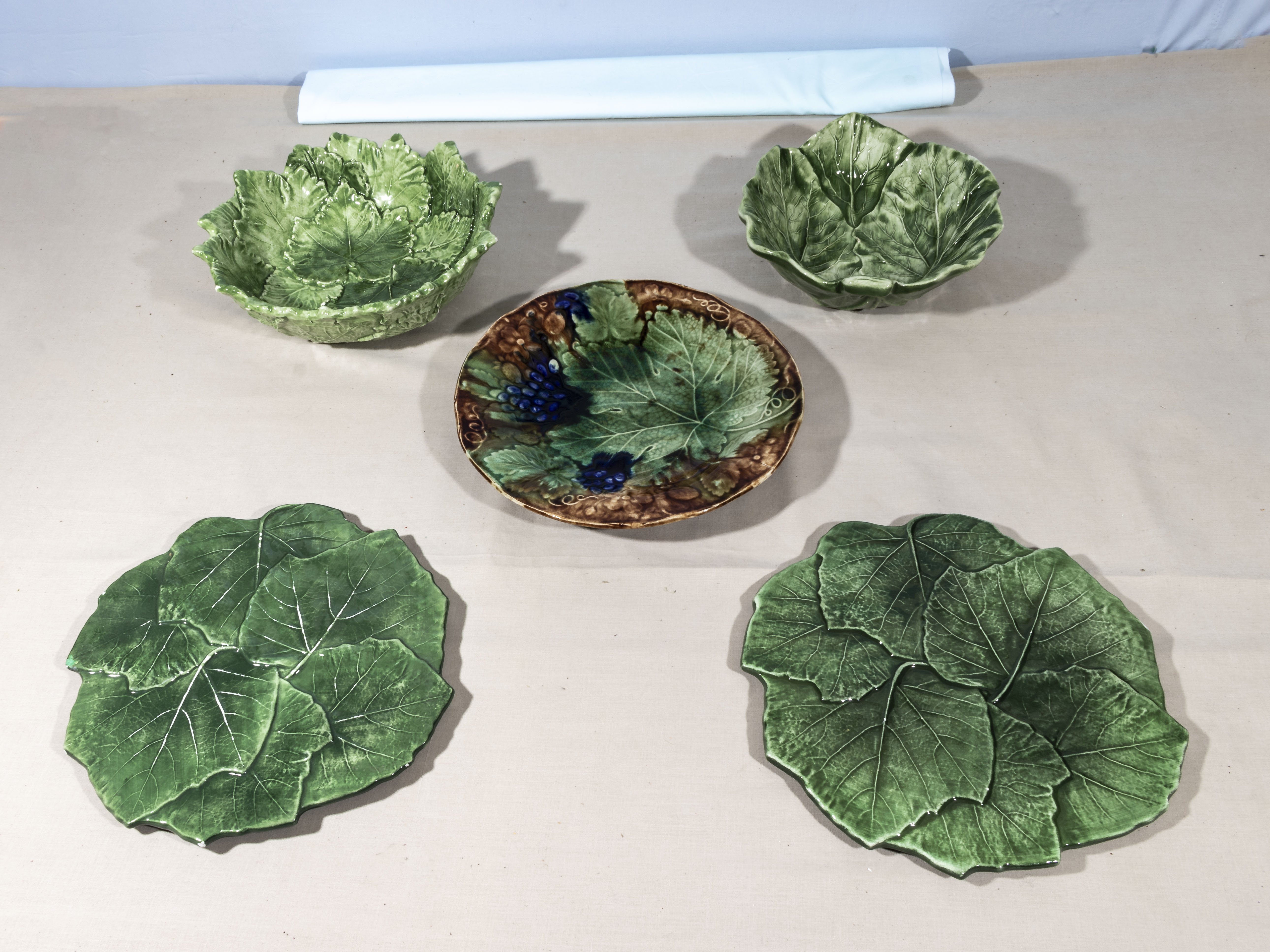 Two cabbage Portugal leaf bowls and three leaf plates