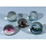 Five glass paperweights