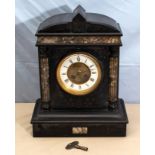 A Victorian black slate clock