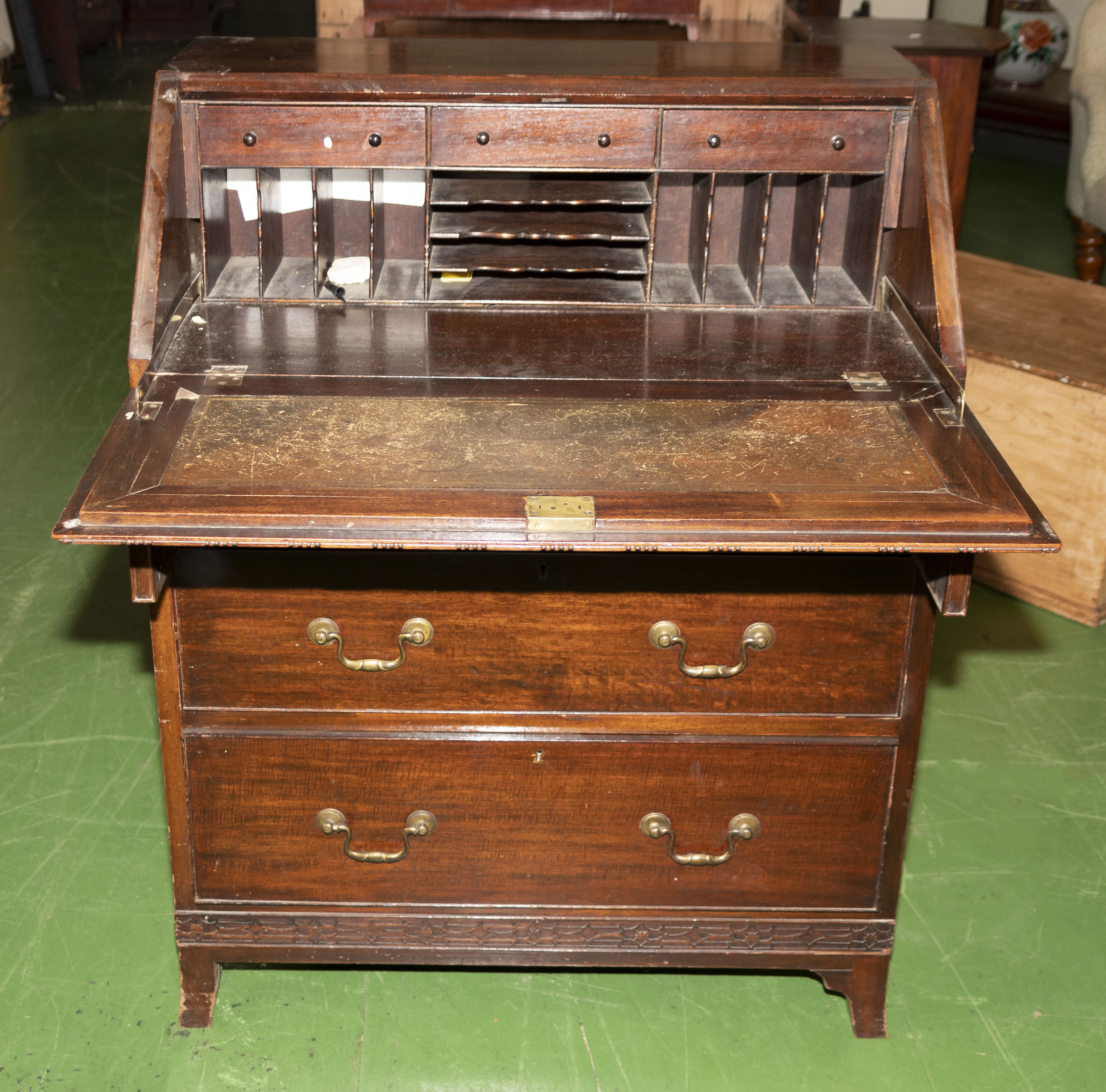 A mahogany bureau with fitted interior