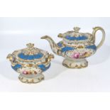 A decorative teapot and lidded sugar bowl