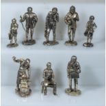 A collection of silver plated figures depicting Victorian trades