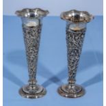 A pair of silver posy/bud vases 16cm tall marks for London 1927, weighted.