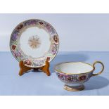 The cup and saucer is a facsimile of one used by Napoleon, label to base of cup. Cup dia. 12cm.