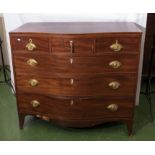 A Georgian mahogany serpentine front chest of three drawers over three. Provenance: Being the