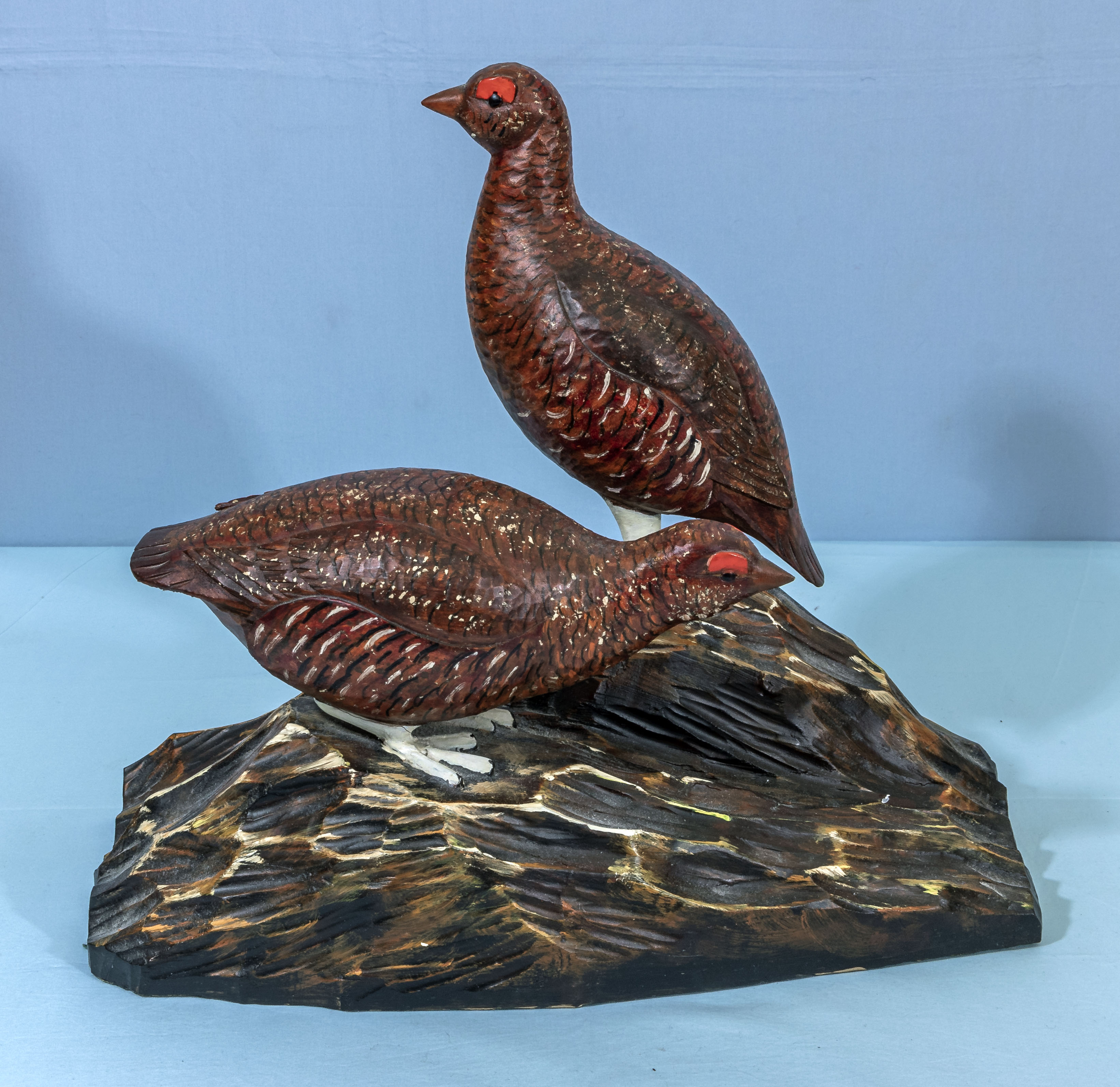 Two carved wooden grouse