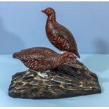 Two carved wooden grouse