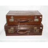 Two vintage leather suitcases