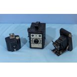 A vintage Kodak Vest Pocket camera, Conway camera and a lens