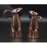 Two Joseph Sankey & Sons copper jugs stamped JS&S 29cm and 26cm tall
