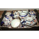A box of assorted pottery teapots and other tableware