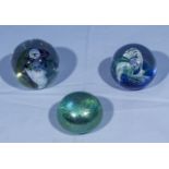 Three Caithness glass paperweights