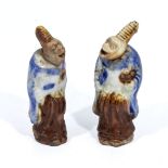Two Oriental netsukes with nodding heads, one repaired, 8cm tall
