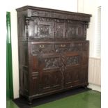 A period oak court cupboard with carved panels and doors Circa 1680/1700.