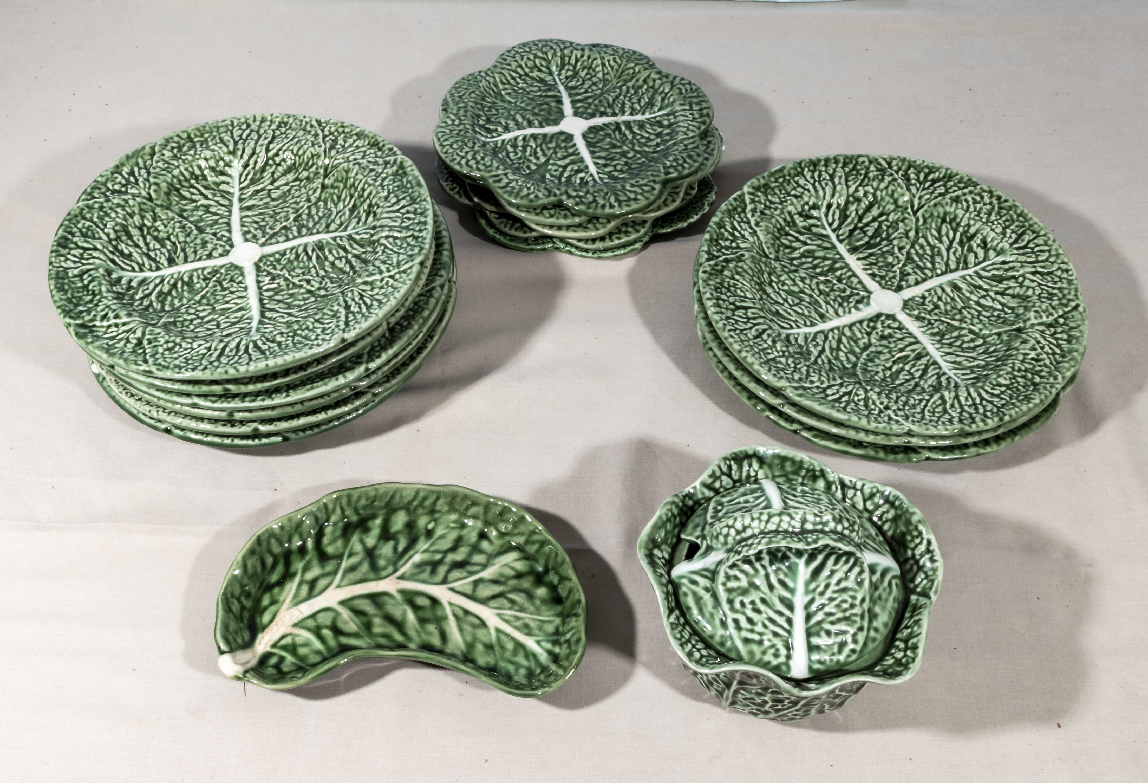 A quantity of Portugal cabbage leaf plates and dishes