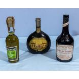 Two vintage bottles of wine and a bottle of Chartreuse