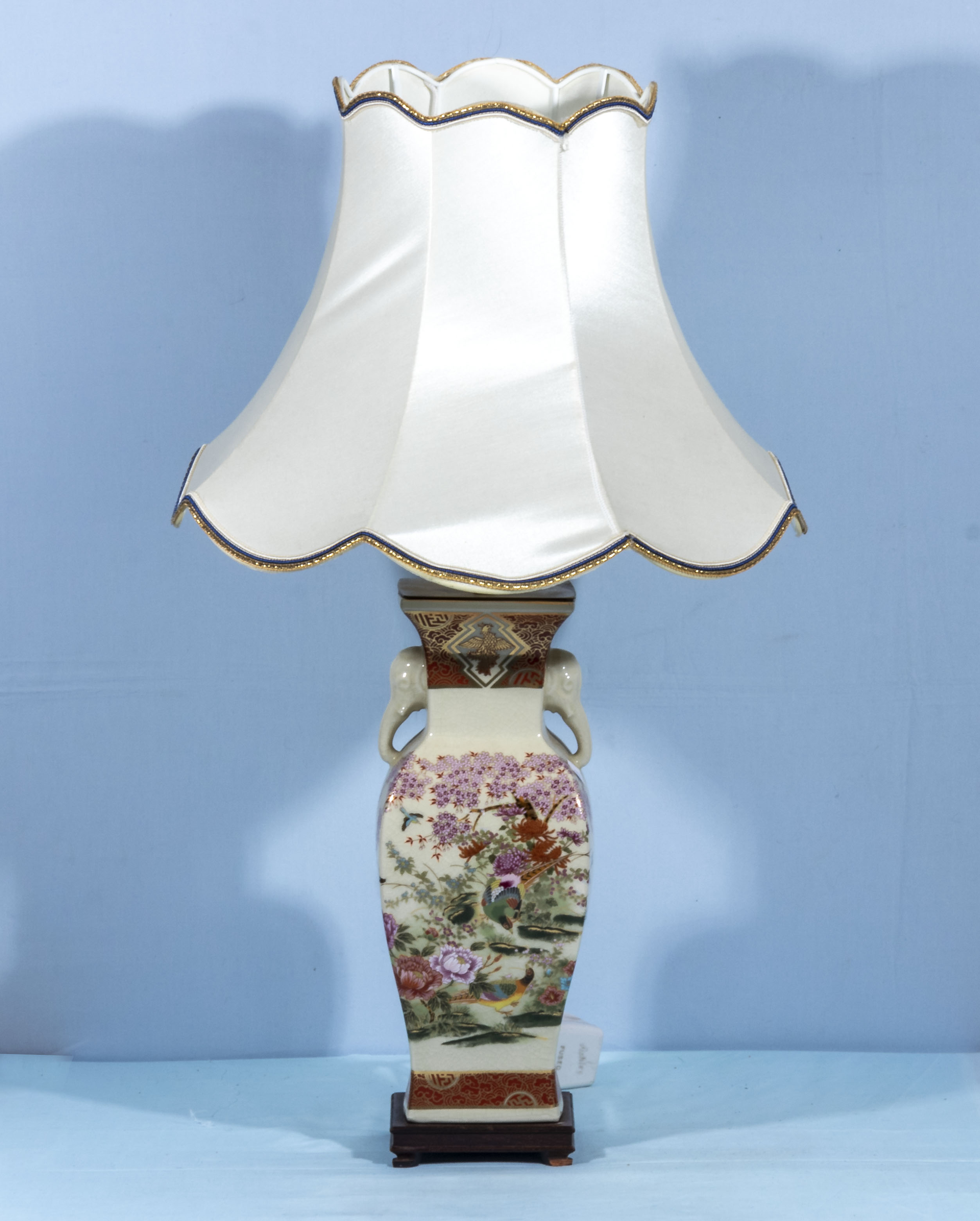 A Chinese style pottery table lamp and shade