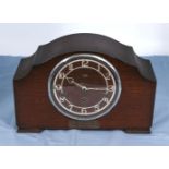 An oak mantle clock