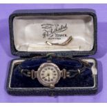 A ladys 9ct gold watch with bracelet pieces