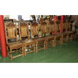 A set of eight pine high back dining chairs.