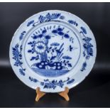 An 18th Century Dutch Delft dish with blue floral decoration, 34cm dia.