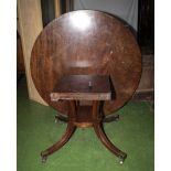 A Regency style round dining table. A/F