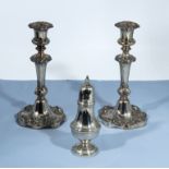 A pair of plated candlesticks and a sugar shaker