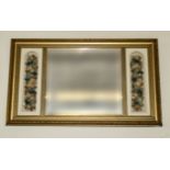 A gilt framed wall mirror with dried flower decoration, 64cm x 98cm