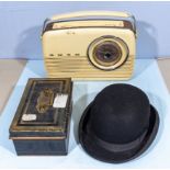 A Bush radio A/F, petty cash box, brass button protector and a bowler hat